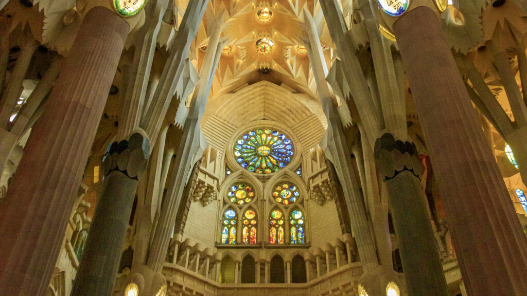 Towering pillars and stained-glass windows of La Sagrada Familia.