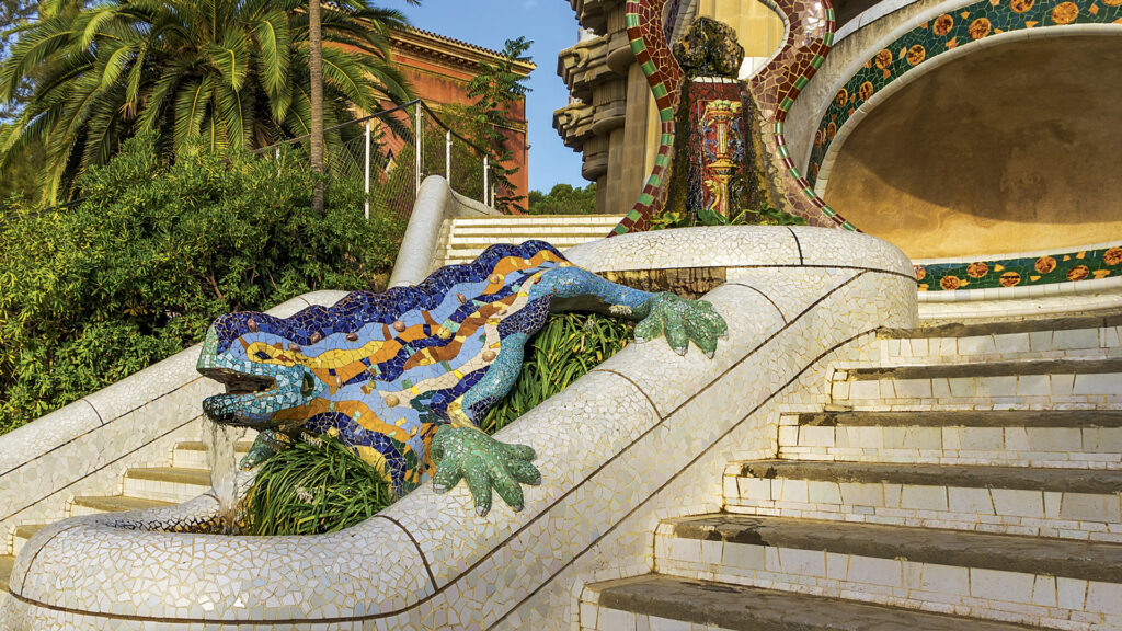 A colourful, blue-and green mosaic tiled lizard in Park Güell
